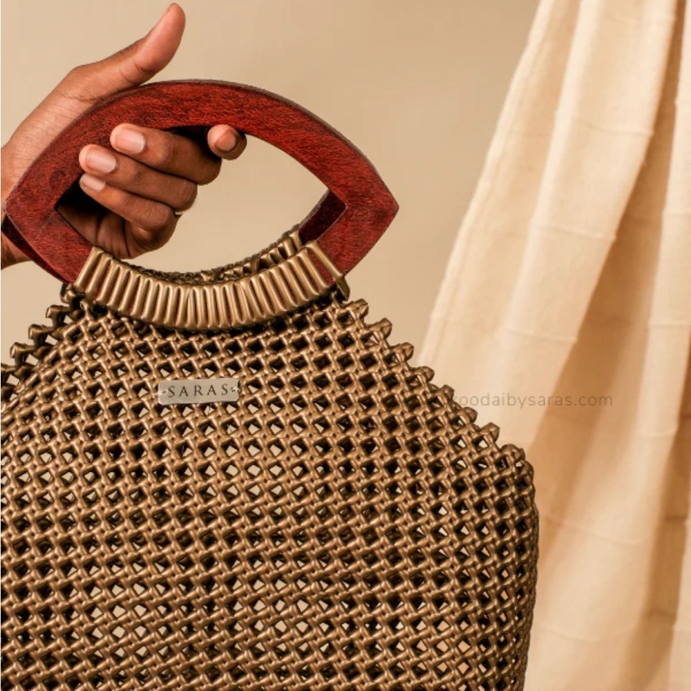Saras Gold Kai Koodai  to toe bag  paired with wooden handles, super unique